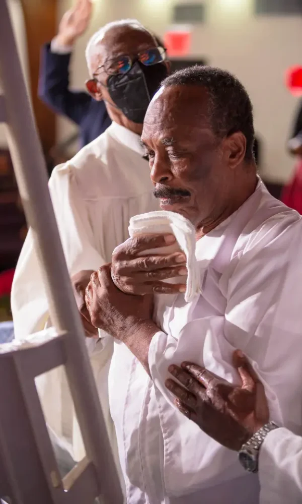 African American Male Being Baptized
