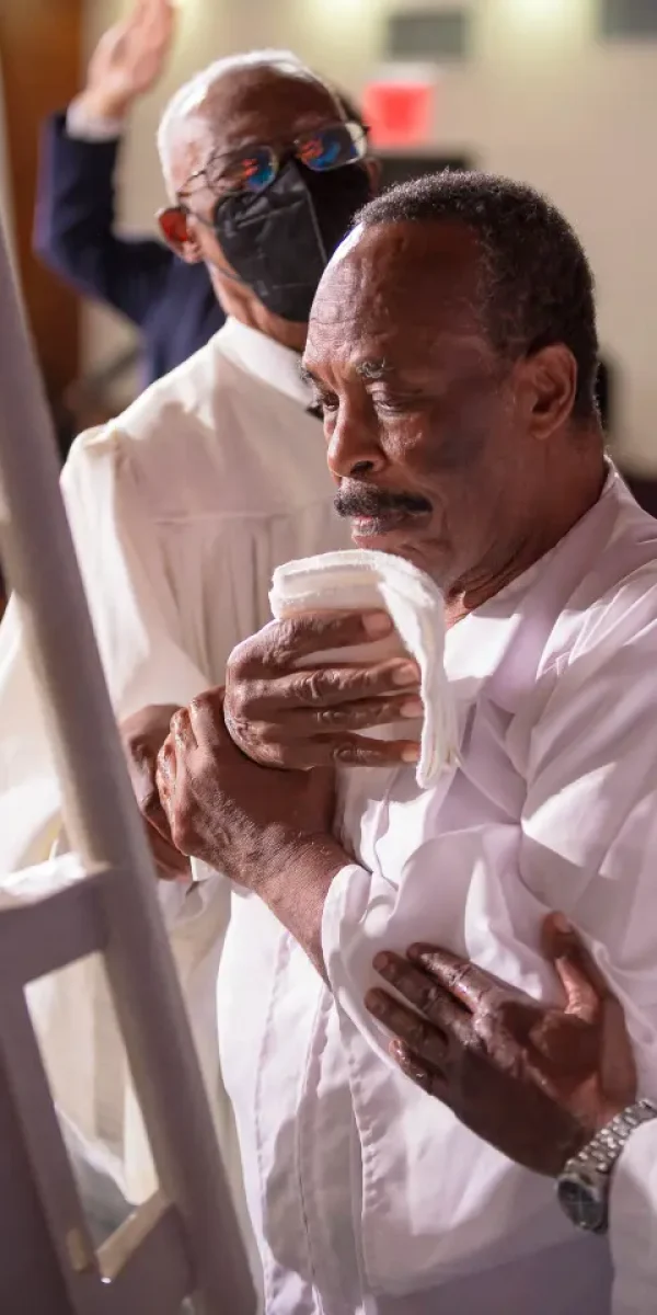 African American Male Being Baptized